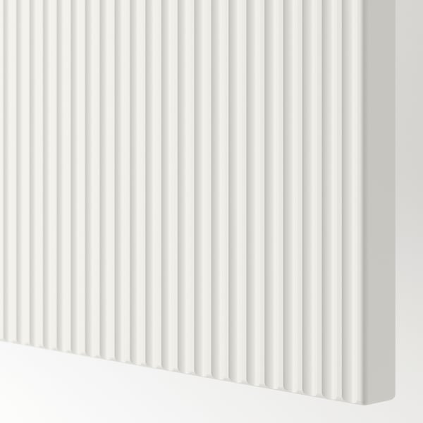 Close-up of white FÖRVALTARE drawer front with sleek, evenly spaced fluted design, smooth finish.
