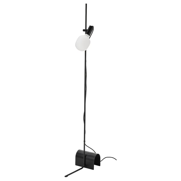 A black HÅRSLINGA floor lamp with a frosted glass bulb and adjustable arm.