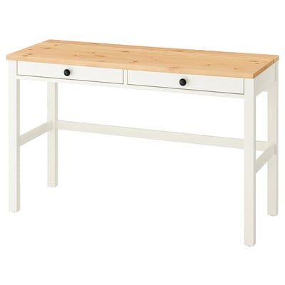 A white and light wood HEMNES desk with two drawers and sturdy legs.