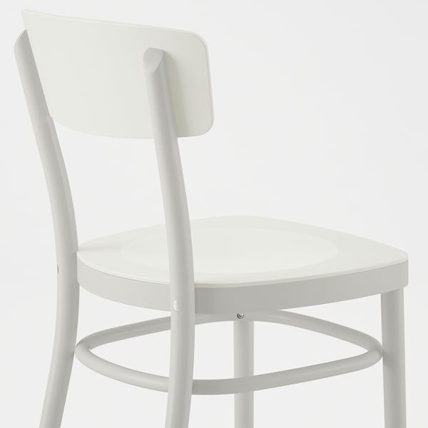 Modern white chair with curved back and seat, sturdy wooden frame.