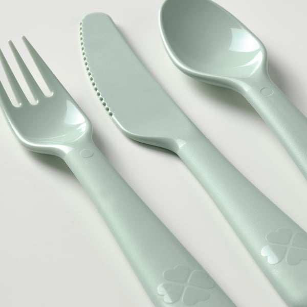 Image a kids utensil set: mint green fork, knife, and spoon. Durably designed for easy grip and cutting.