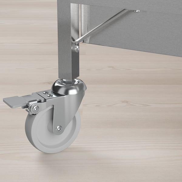 Sturdy metal caster wheel attached to kitchen trolley. High quality material for durability and easy cleaning.