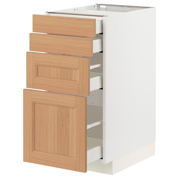 A white METOD kitchen cabinet with oak drawers. The unit includes three large drawers and a single door, providing ample storage.