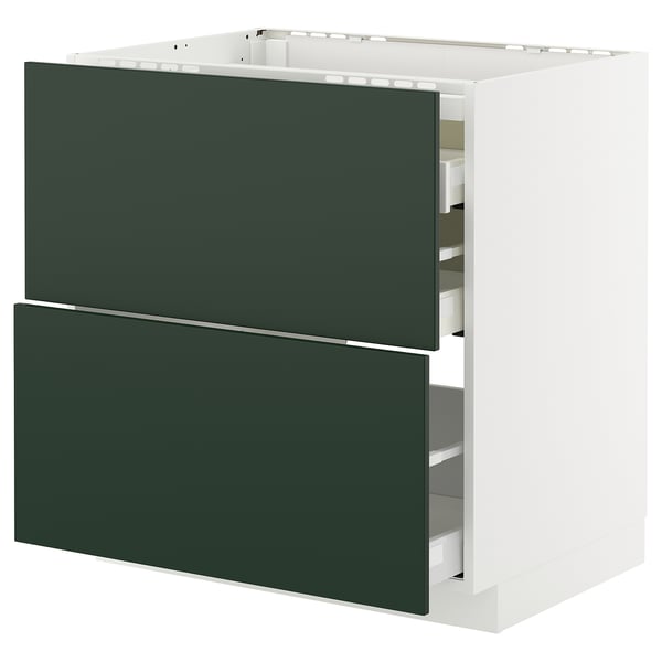 New kitchen unit, dark green drawers, white sides, modern design, integrated storage.