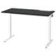 An adjustable MITTZON desk with a black top and white legs. It has a sleek, modern design with cable management slots.