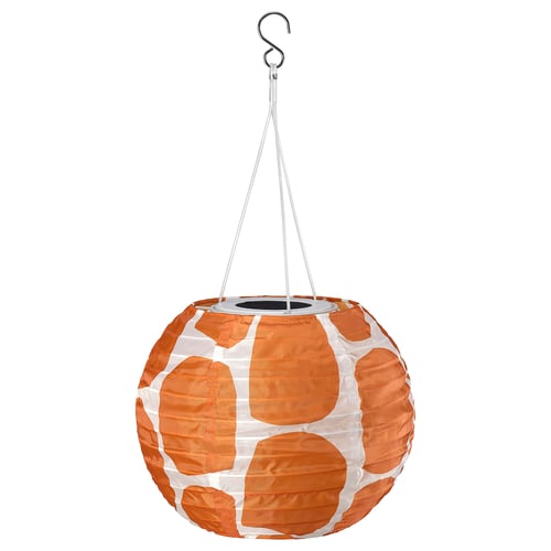 SOLVINDEN orange lantern, round, giraffe print pattern, made from recycled pet bottles, hangs from a hook, solar-powered.