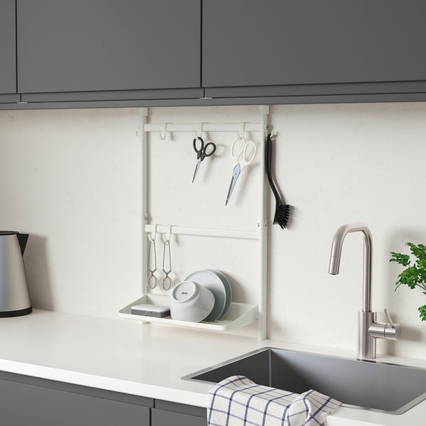 Modern white SUNNERSTA kitchen rack holding utensils, small, fitting under cabinet.