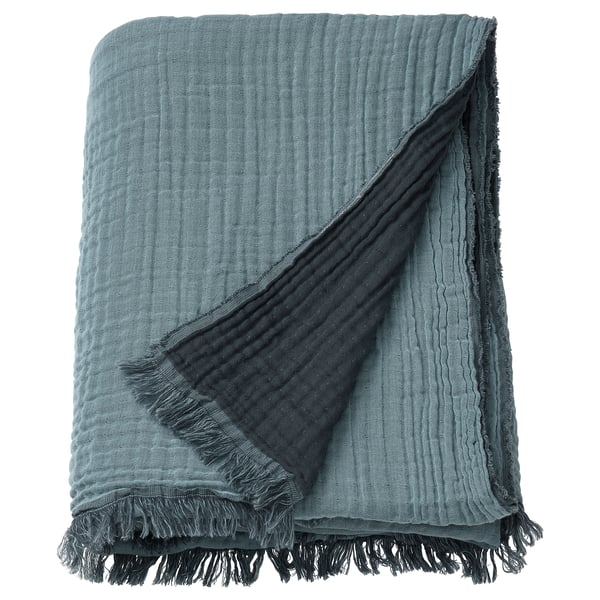 VALLKRASSING: teal blue cotton throw blanket, crinkled texture, fringe edges.