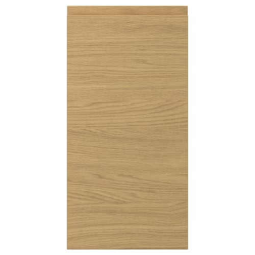 A VOXTORP door front. It is rectangular, in an oak colour, with a smooth finish and integrated handles.