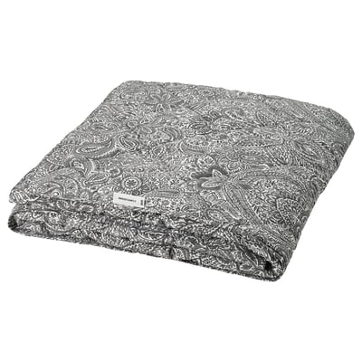 Grey & white patterned duvet, folded. Recycled polyester filling, adorned with floral designs.