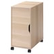A light brown wooden ALEX storage unit with wheels. The cabinet a single door with a handle and castor wheels for mobility.