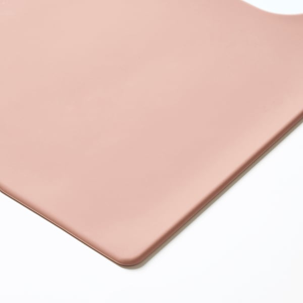 Smooth, light pink silicone placemat. Even edges and sleek surface.