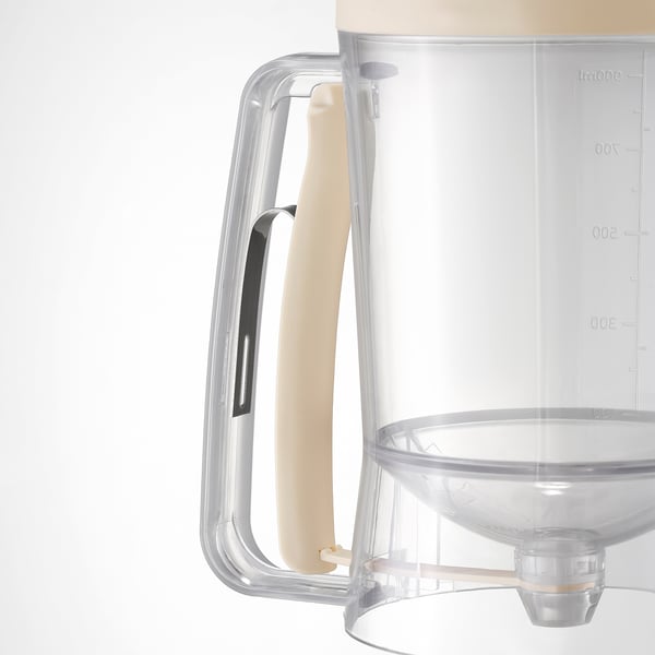 Clear measuring jug with cream handle, precise markings, non-slip grip, easy to use.