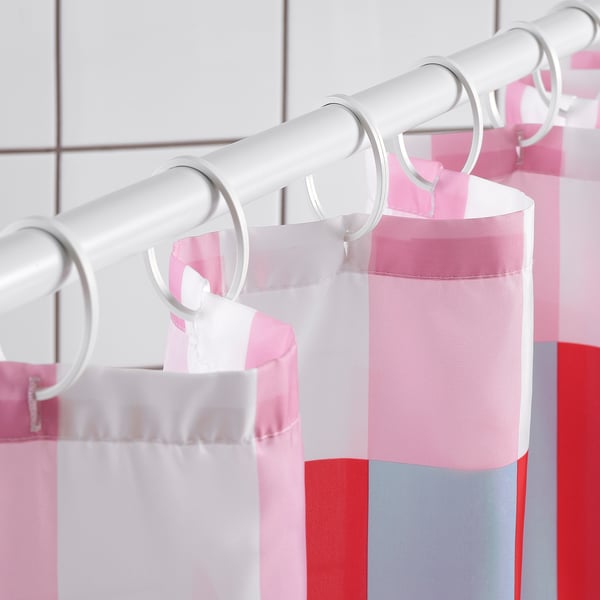 A shower curtain with colourful blocks, featuring white, pink, red, and grey stripes. The water-repellent fabric keeps the curtain dry.