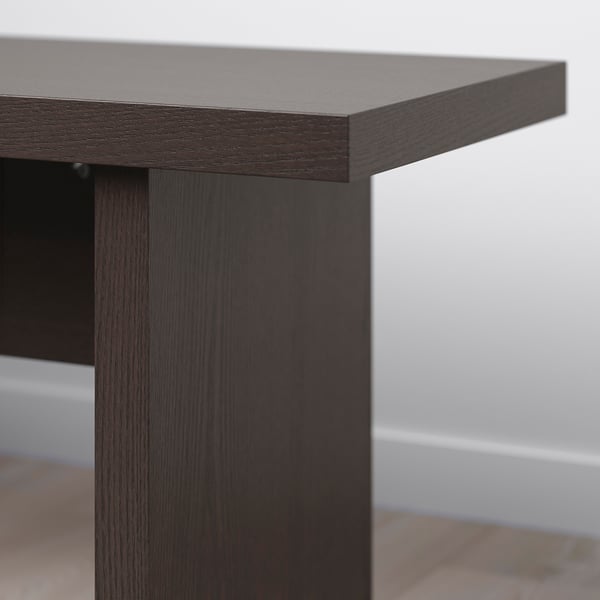 Dark wood table edge detail, polished finish, sturdy construction.