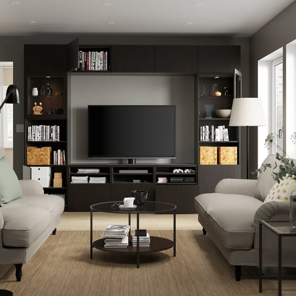 Modern living room with BESTÅ tv storage, sofas, coffee table, and dark wood floor.