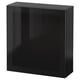 Black square storage cabinet with glass door. Modern design, glossy finish. Suitable for organising home items.