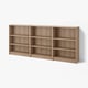 A BILLY bookcase in light brown, featuring three sections with adjustable shelves.