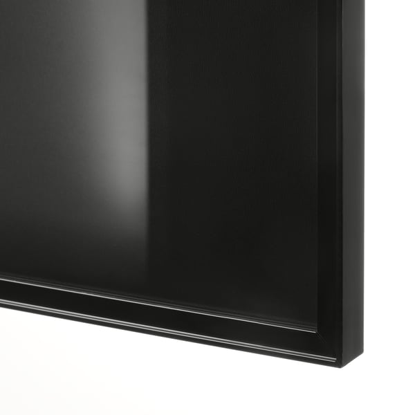 Close-up of sleek, black BILLY bookcase corner. Smooth finish, sturdy build.