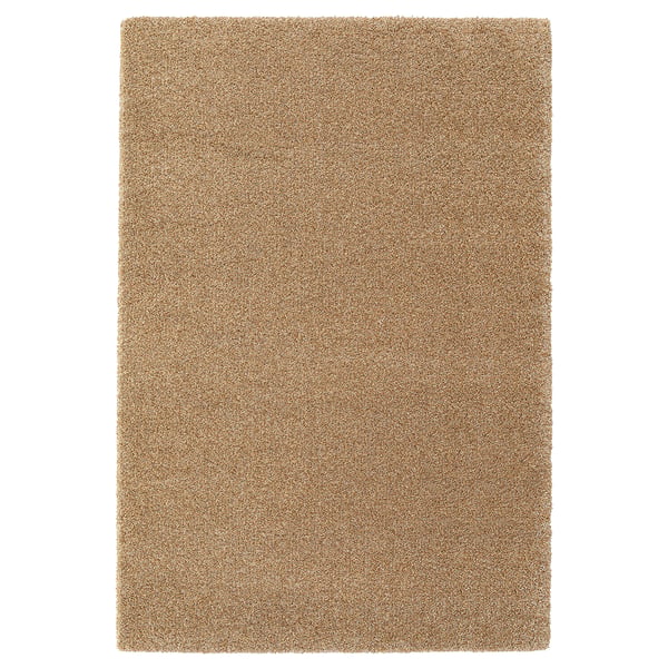 A BREVBÄRARE rug, rectangular, in brown, made of 100% polypropylene pile and synthetic rubber backing.
