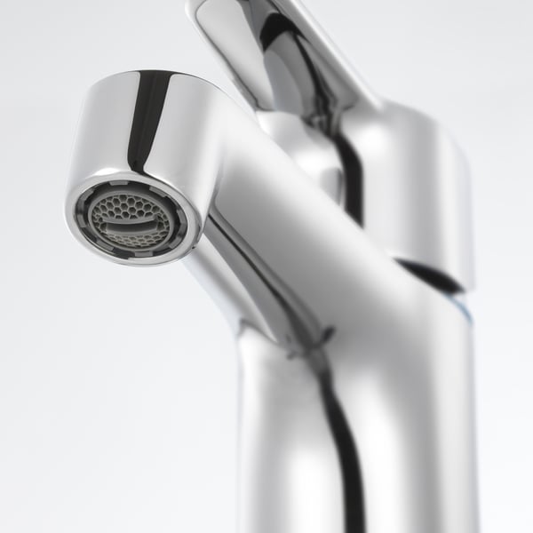 Image depicts a close-up of a sleek, modern chrome-plated tap with intricate design and quality finish.