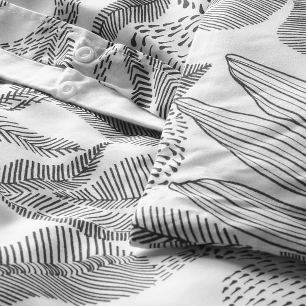 Black and white duvet cover with graphic floral design and plastic press-stud closure.