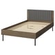 A modern BRUKSVARA bed in dark brown with a cushioned headboard, wooden slats, and metal legs.