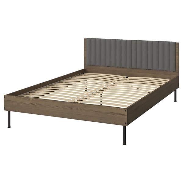 BRUKSVARA bed: brown wood finish frame, grey padded headboard, metal legs, minimalist design.