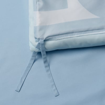 Close-up of soft duvet with ties, machine-washable, good for allergy sufferers.