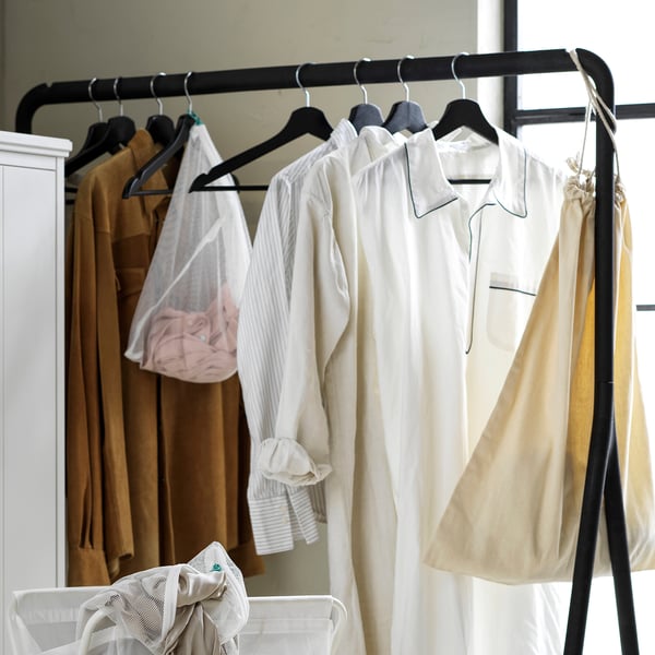 Clothes hanger with grooves holding garments - keeps clothes neat and secure.