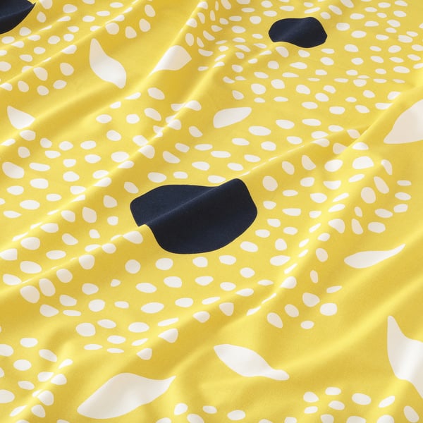 Bright yellow fabric with white and navy blue organic shapes, high quality cotton texture.