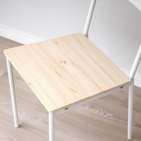 Minimalist white metal table with light wood top, showcasing sturdy design and sleek lines. Ideal for compact spaces.