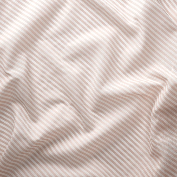 Soft, wavy stripes on sheer rose curtain, showcasing quality fabric texture and elegant design.