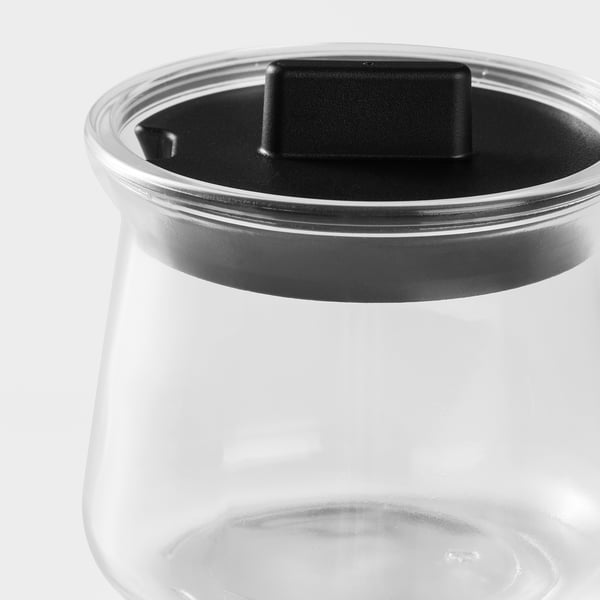 Clear glass container with black lid, shows quality and transparency.