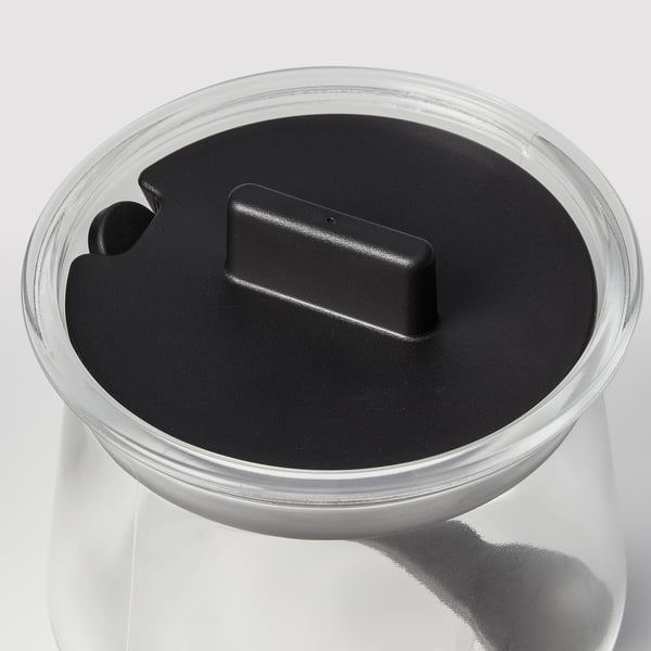 Clear glass canister with black plastic lid, simple and elegant.