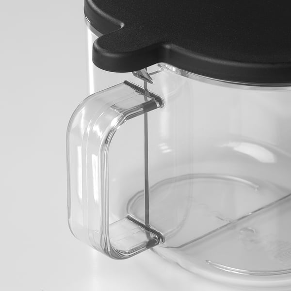 Clear plastic spice jar with black lid, two compartments, and silver spoon, designed for one-handed use.
