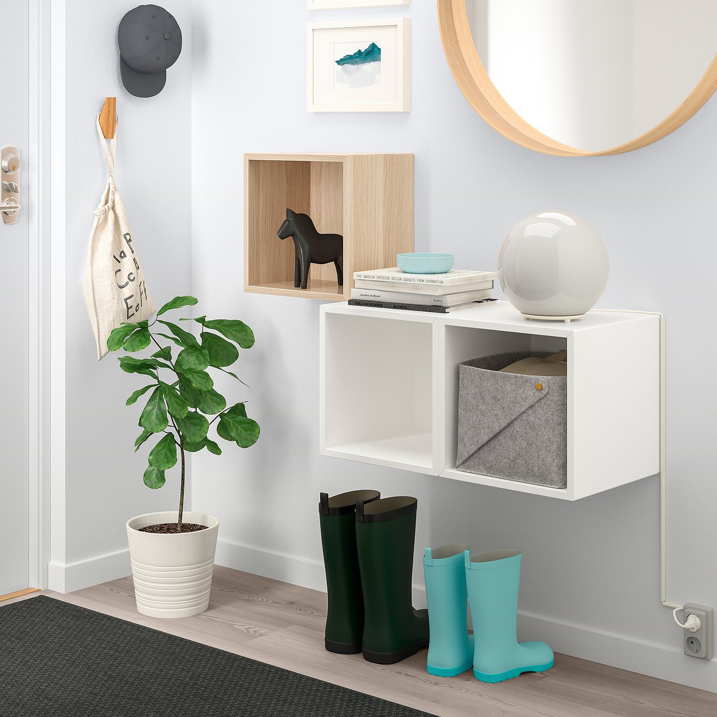 EKET wall cabinet with books, boxes, horse, boots, plant & mirror.
