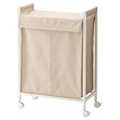 An ENHET laundry hamper with a beige fabric bag on a white metal frame with wheels.