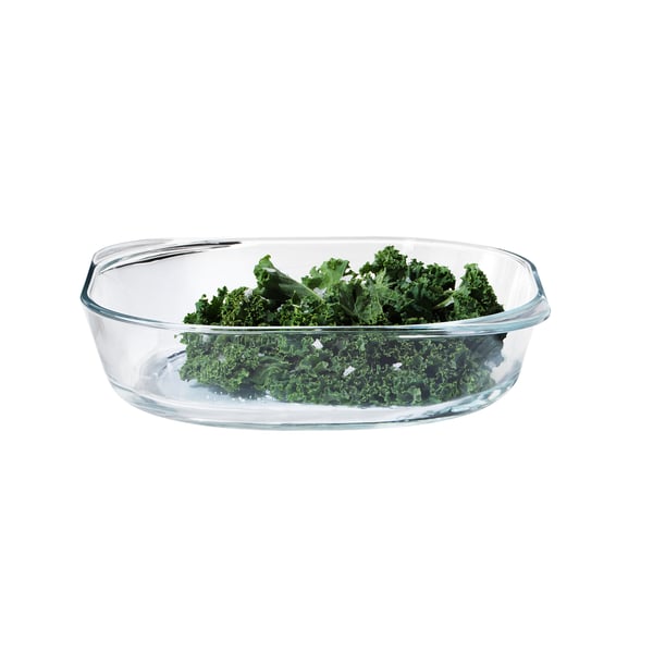 Clear glass dish with green kale, minimalist design.
