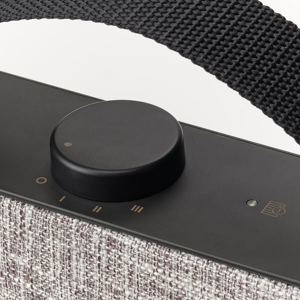 Black air purifier controller with fabric strap.