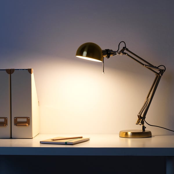 A classic desk lamp with an adjustable arm and shade, providing bright directional light for tasks.