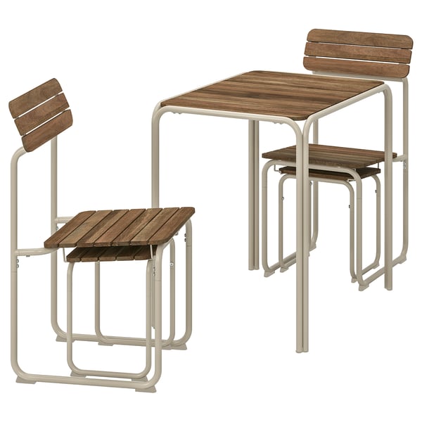 A FURUÖN outdoor furniture set with a brown wooden table and light beige metal chairs.