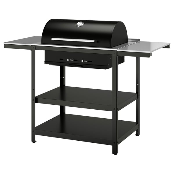 Black outdoor grill with side tables, stainless steel top, on a metal stand.