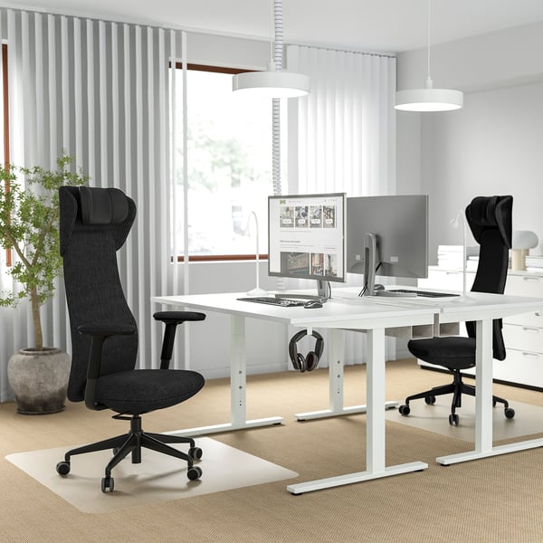 Modern office setup with GRÖNFJÄLL ergonomic chair, adjustable desk, dual monitors, and plant.