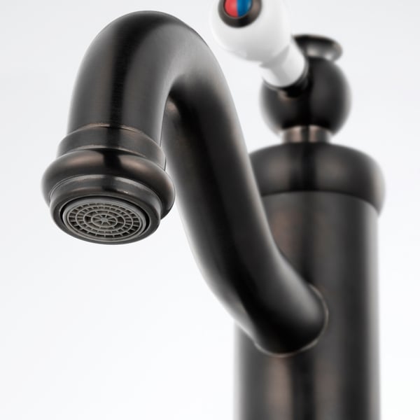 Black tap with sleek curve, small aerator tip, and metallic shine, mounted on a white background.