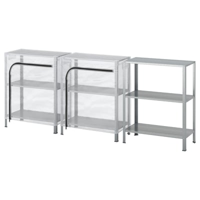 Three silver metal shelving units, two with transparent dust covers.