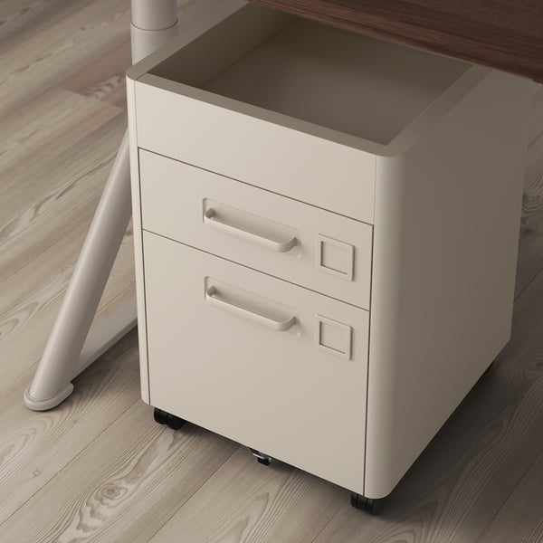 White under-desk storage unit with easy-roll castors and silent-closing drawers.