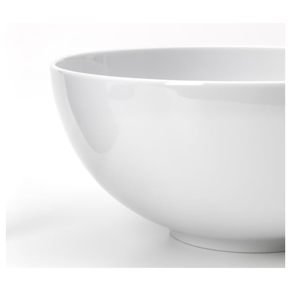 Close-up of ikea porcelain bowl, showcasing smooth, glossy finish and elegant shape.