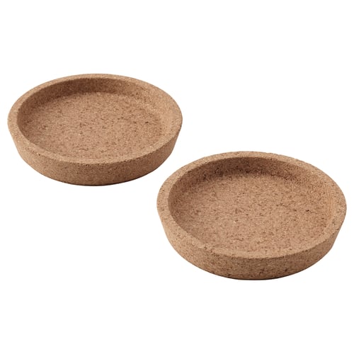 Two round cork coasters. Simple and natural design, protect table surfaces.