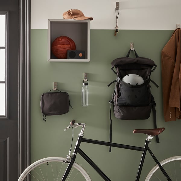 Sports gear wall: basketball, cap, speaker, backpack, helmet, bottle, pouch, bike.